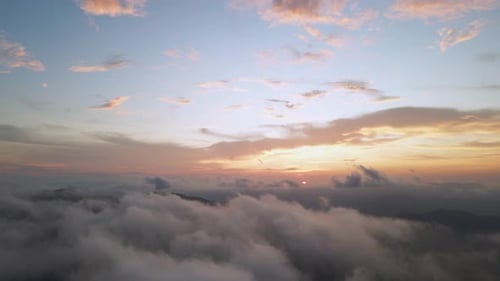 Aerial View of Clouds and Mountains at Sunset