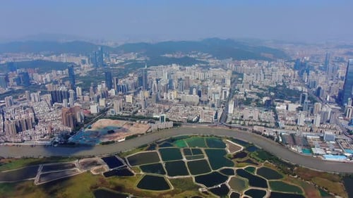 Aerial view over Shenzhen skyline on a beautiful clear day.