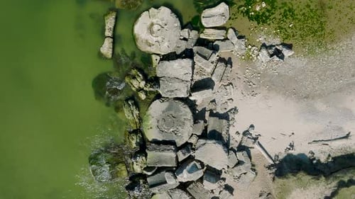 Beautiful aerial establishing view of Karosta (Liepaja) concrete coast fortification ruins, calm Bal