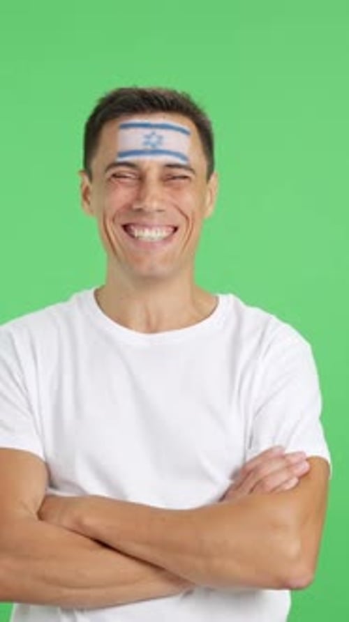Man Smiling Wearing Israel Flag On Forehead