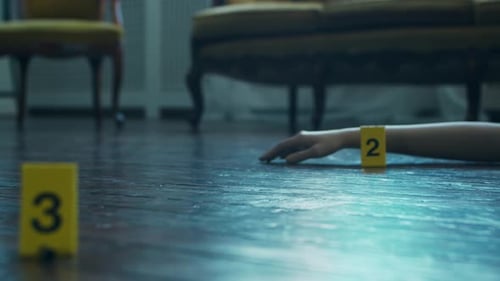 Woman's Hand Next to Evidence Marker on Floor, Buildings ...