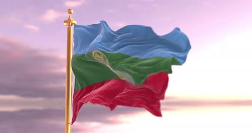 Realistic Waving Flag with Mountain, Sun, and Bird Emblem at Sunset