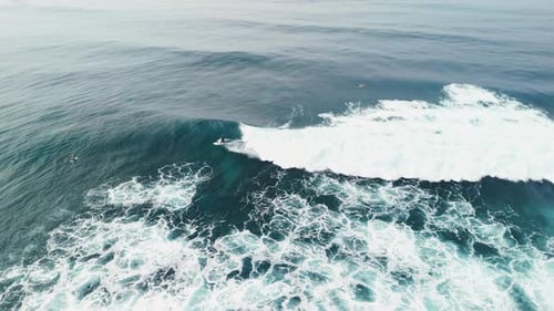 Drone View of Surfer Riding on Wave Perfect Breaking Waves in Ocean