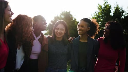 Group of multiracial friends having fun together at park city, Happy young women hugging each other