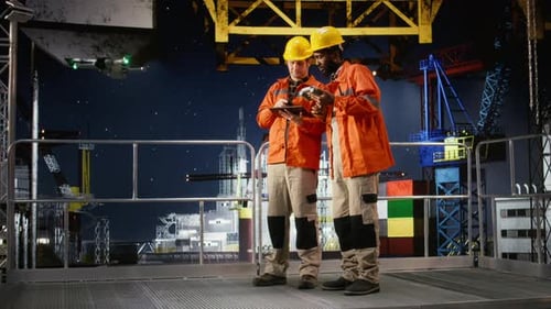 Diverse Experts Using Aerial Photography for Offshore Rig During Drone Survey