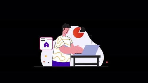 European male working on a laptop at home with a desk lamp