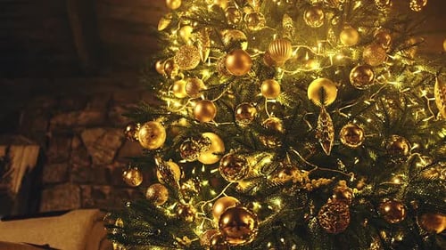 Glowing Christmas Tree with Golden Ornaments and Lights