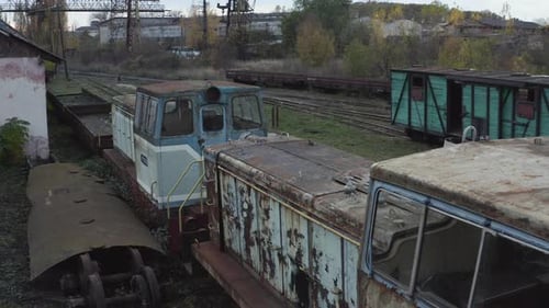 Aerial View of Old Rusty Locomotives and Wagons of a Narrow Gauge Railway