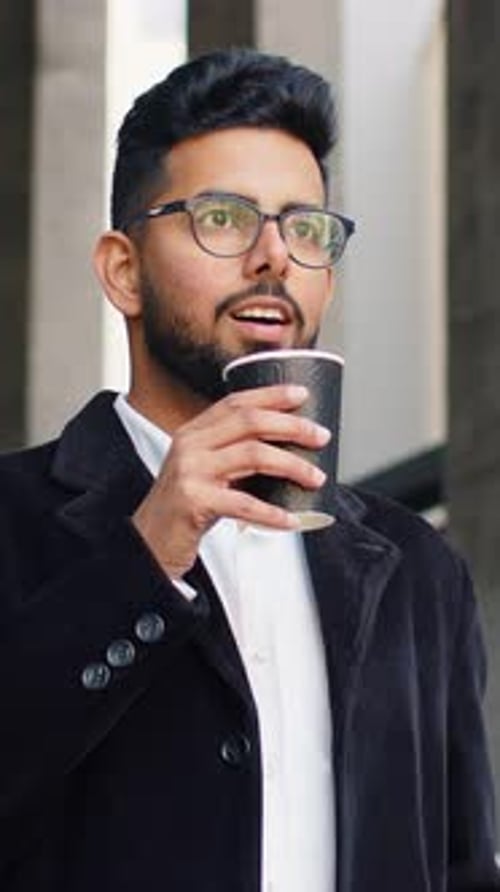 Happy Indian Business Man Enjoying Morning Coffee Hot Drink Relaxing Taking a Break in Downtown City