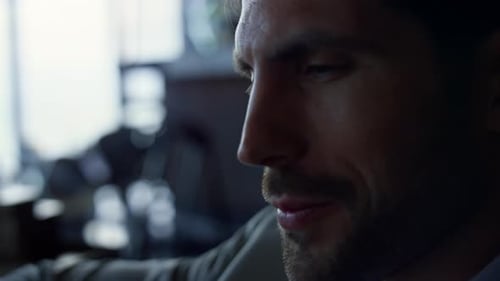 Man in Blazer Using Mobile Device Inside