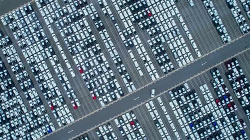 Aerial view from drones flying over a lot of cars