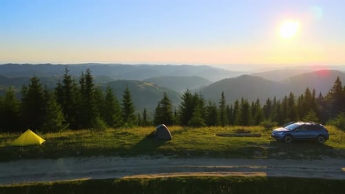 Camping Tents and SUV Car at Mountain Campsite on Bright Sunny Evening Active Tourism and Offroad