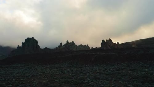Dramatic Landscape with Jagged Rock Formations at Sunset