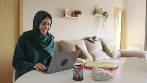 Young Woman Video Conferencing From Home