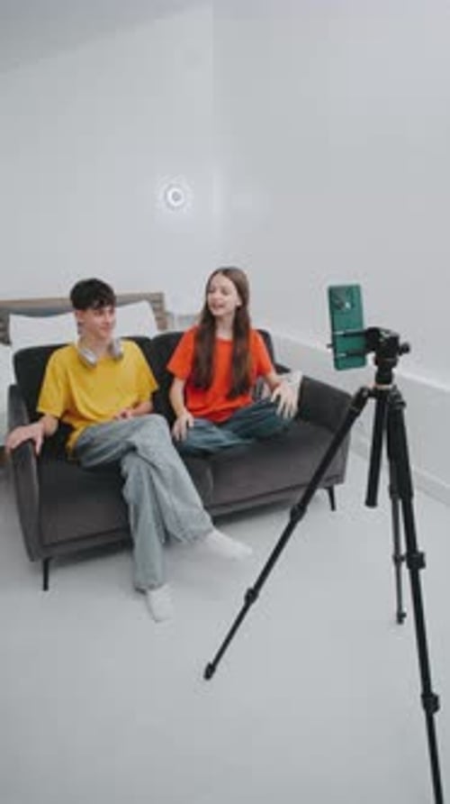 Teenagers Recording Video Blog on Sofa