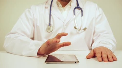 Doctor Using Tablet