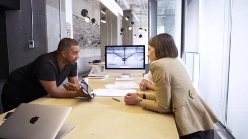 Office Workers Discussing Information on Tablet Device