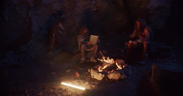 Close Up Neanderthals Wearing Animal Skin Discovering Tablet Computer ...