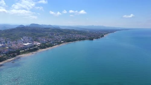 Aerial view of city coastline and blue sea