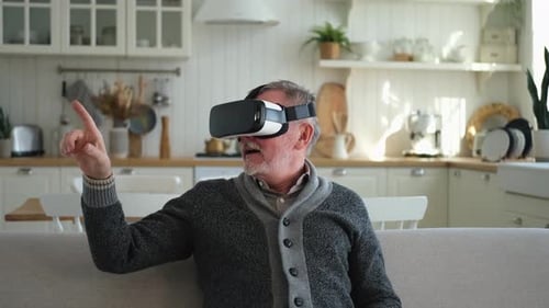Senior Man Experiencing Virtual Reality in his Home