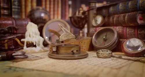 Vintage style travel and adventure. Vintage old compass and other vintage items on the table.