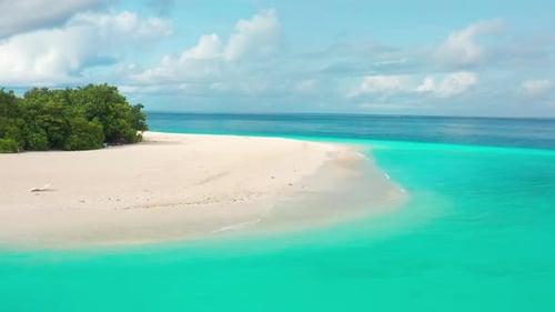 Aerial View of White Sand Beach and Turquoise Sea with Waves on Tropical Island Ukulhas Maldives