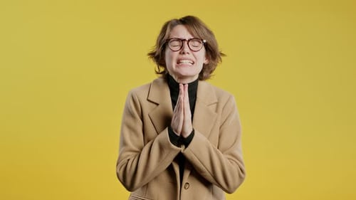 BusinessWoman Praying Begs to Apologize Guilty Yellow Studio Hopeful Prayer
