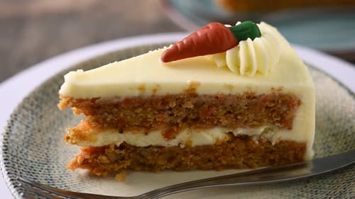 Slice of Carrot Cake with Frosting on Plate