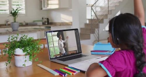 Child Attends Online Class with Laptop at Home