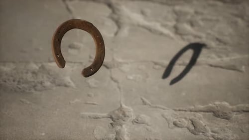 Animated Rusty Horseshoe Falling on Stone Texture