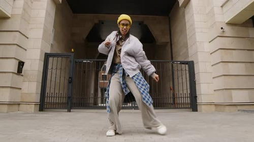Energetic Young Adult Dancing on City Street