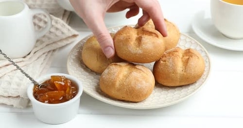 Fresh Bread Rolls with Sweet Jam and Coffee