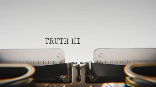 Old mechanical typewriter typing Truth Hid Behind Old Lies in a close-up view.