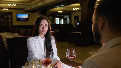 Romantic Couple Drinking Red Wine During Dinner Date