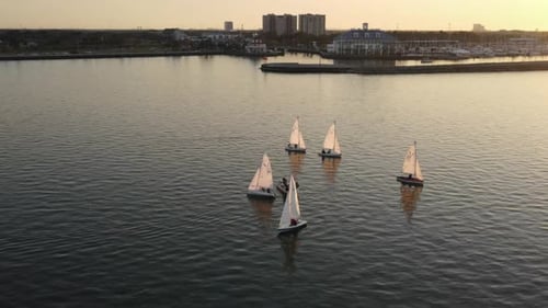 People Watching Romantic Sunset From A Boat At Lake Pontchartrain. - aerial orbit