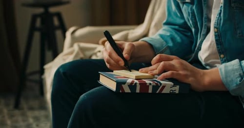 Lucky Student Who Writes and Sticks Cards with English Names of Objects on Things in the Living Room