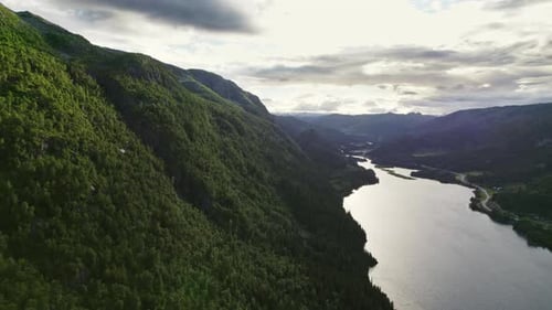 Scenic Mountain River Nestled Amongst Lush Green Mountains