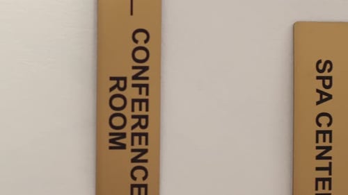 Vertical Video Close Up of Hotel Facilities Plaques