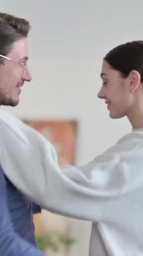 Affectionate Couple Embracing Each Other in a Home Setting