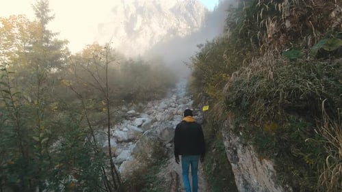 Satisfied Traveler Man Climbing Along a Hiking Route to the Top of Mountain Alps Austria