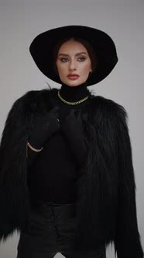 Fashionable Woman Wearing Black Clothes and Gold Chain