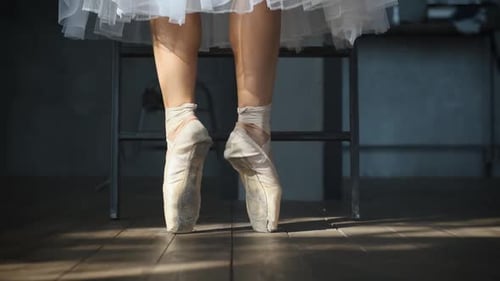 close-up of dancing ballerina's feet in pointe shoes