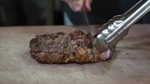 Juicy Steak Sliced on Cutting Board