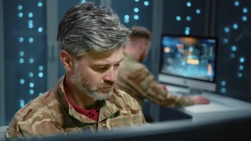 Men Working at Computers in Military Office Setting