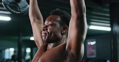 Fitness, weightlifting and workout with black man in gym for bodybuilding or strength training