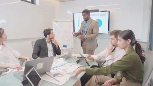 Business Professionals Meeting in Bright Conference Room