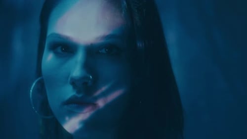 An Emotional Portrait Featuring a Projection of Letters and Digital Patterns Showcasing Depth and