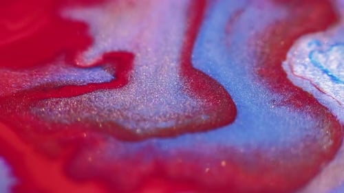 Swirling Red and Blue Liquids Abstract Close Up