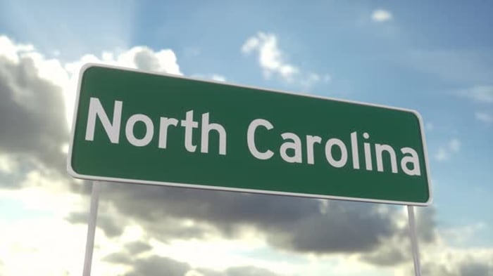 Welcome to North Carolina. North Carolina road sign on a blue sky ...