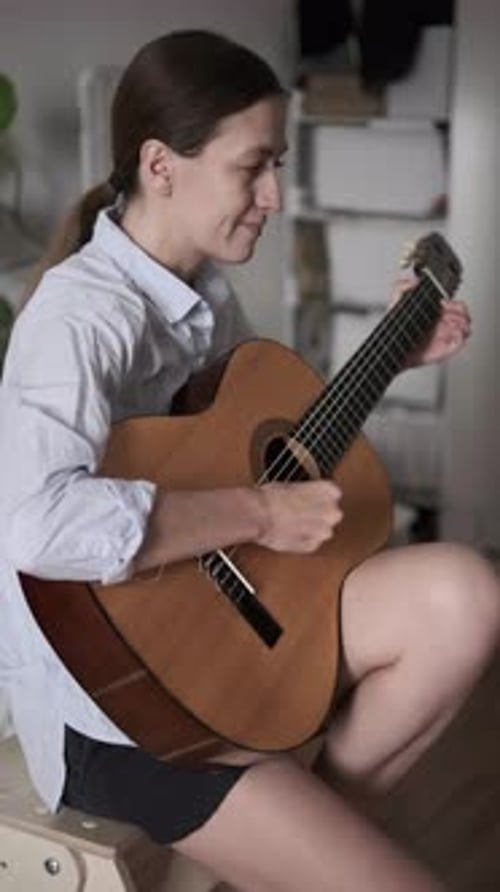 Woman Playing Acoustic Guitar at Home Creative Leisure Music Inspiration Indoor Lifestyle